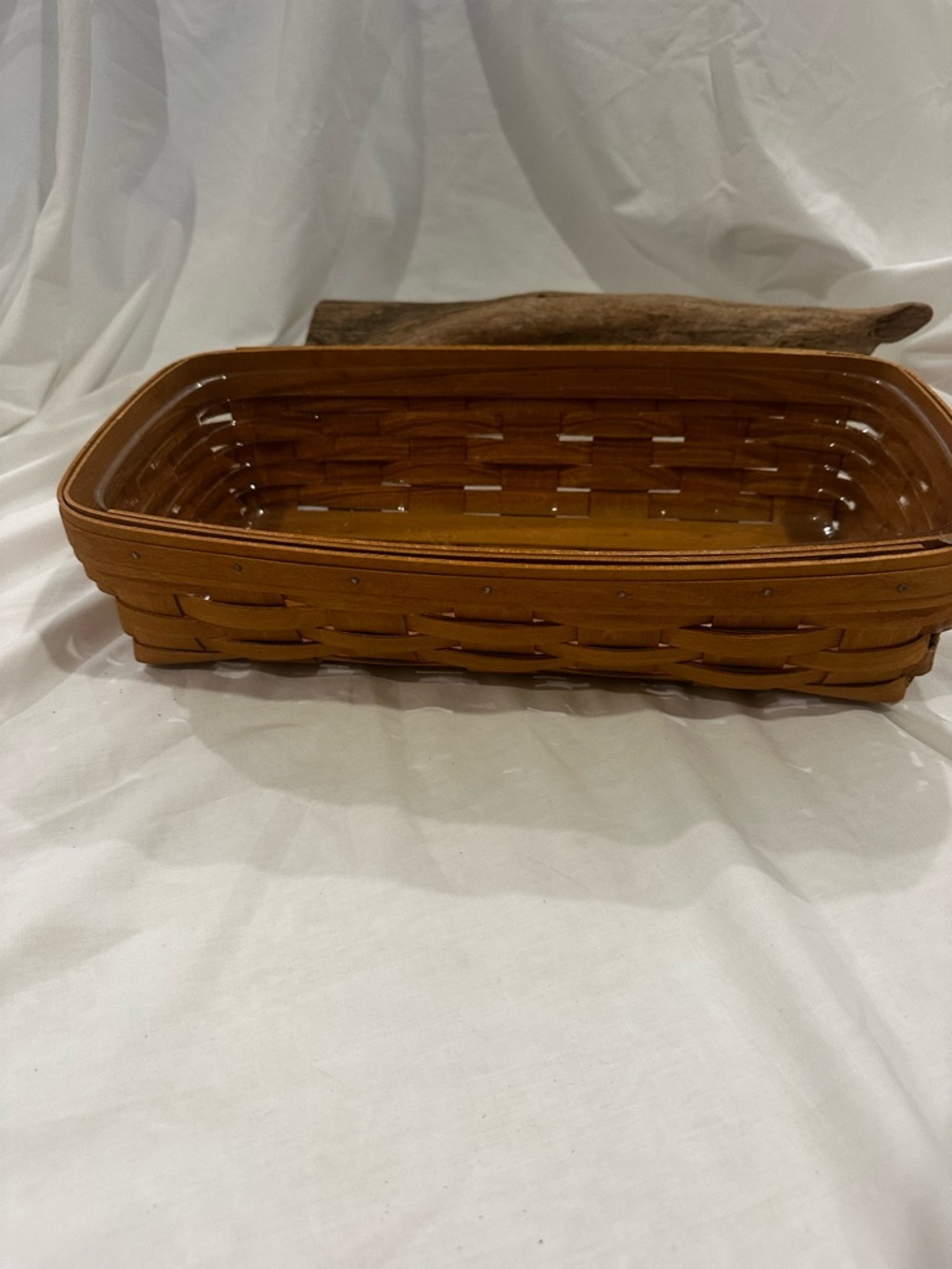 Longaberger woven bread basket, typically crafted from maple wood.